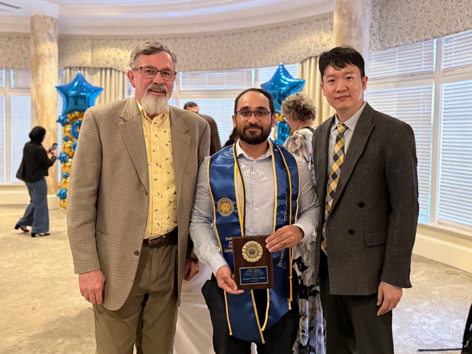 Chris Sebastian receiving Outstanding Small Business Development Center Student at the BPA Honors Banquet 2026