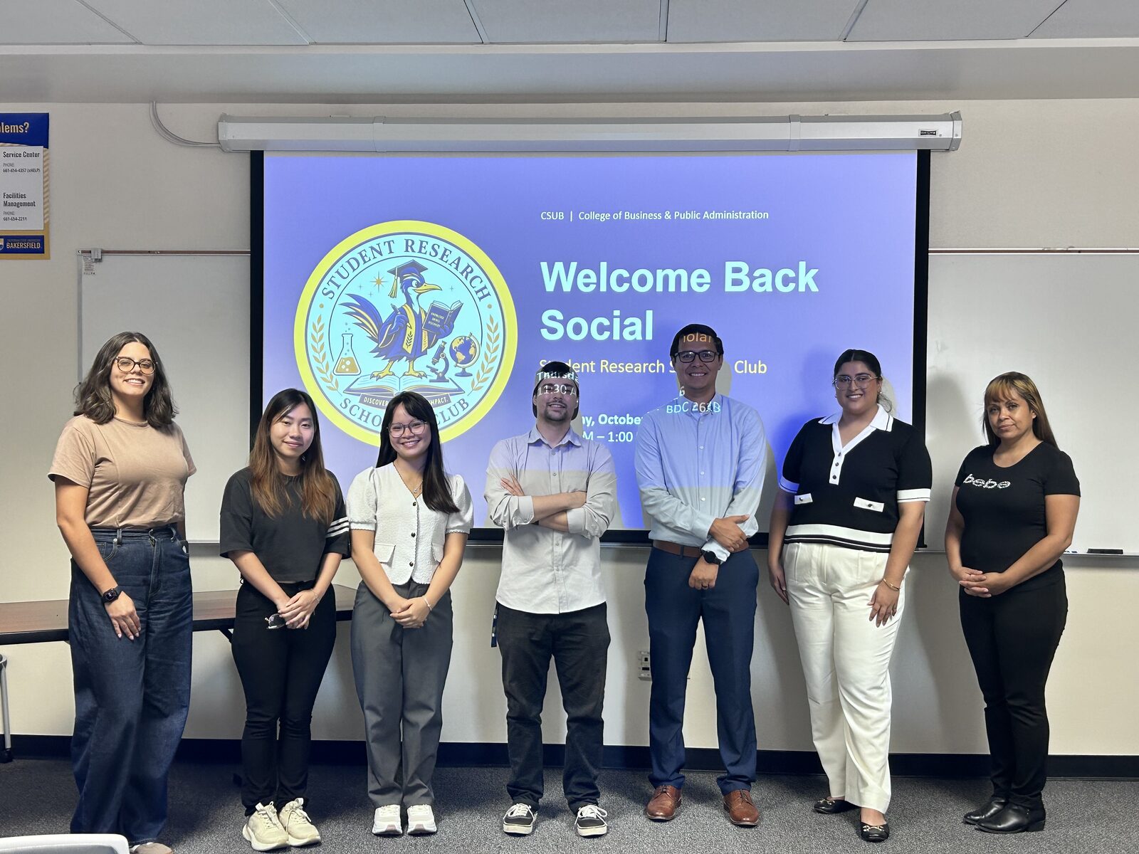 SRSC officers standing together in front of the Welcome Back Social title slide